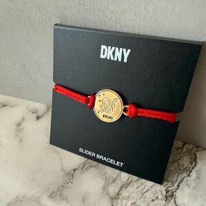 DKNY Gold Medallion Bracelet with Red Cord